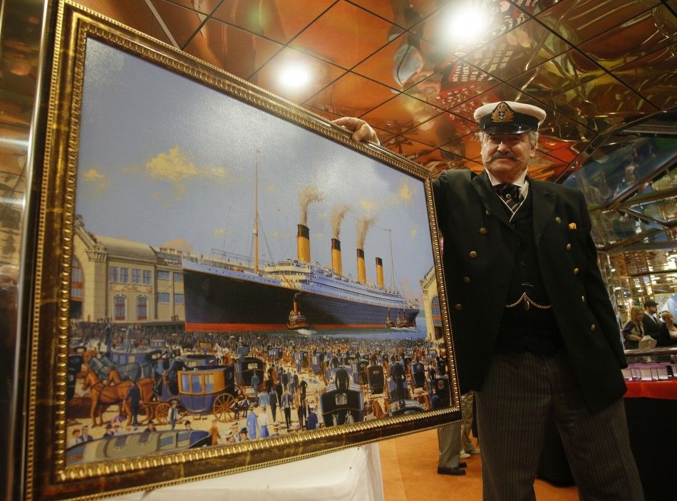 Maritime artist Flood of Del Ray Beach, Florida poses with his painting of the doomed Titanic liner on board the Titanic Memorial Cruise off Cobh