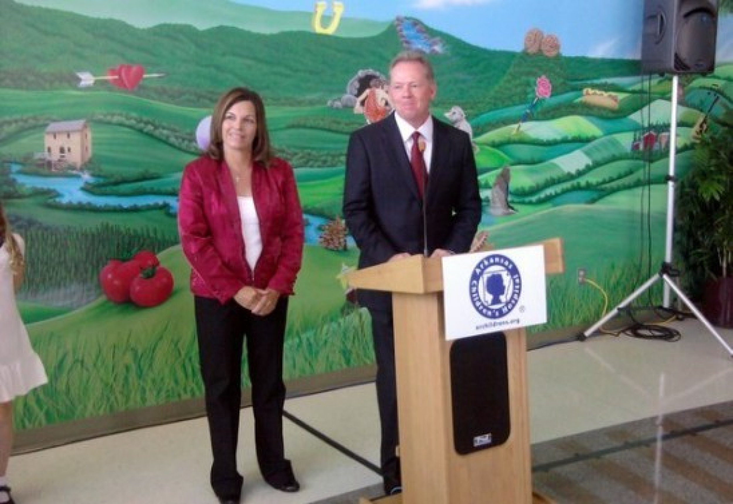 Becky Petrino stands with her husband at an event.