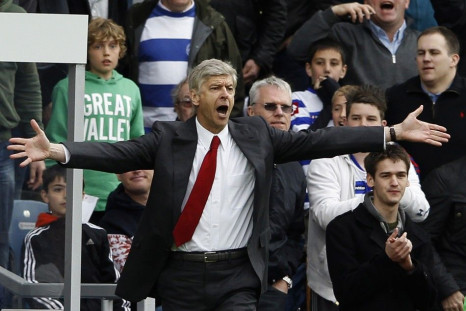 Arsenal manager Arsene Wenger leads his squad into Molineux stadium Wednesday.
