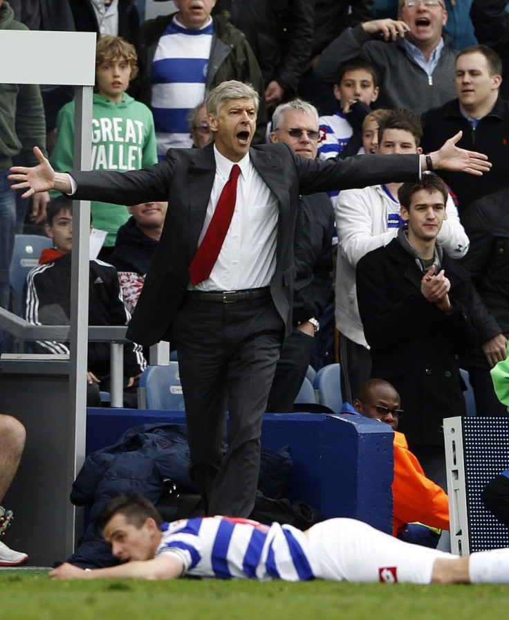 Arsenal manager Arsene Wenger leads his squad into Molineux stadium Wednesday.
