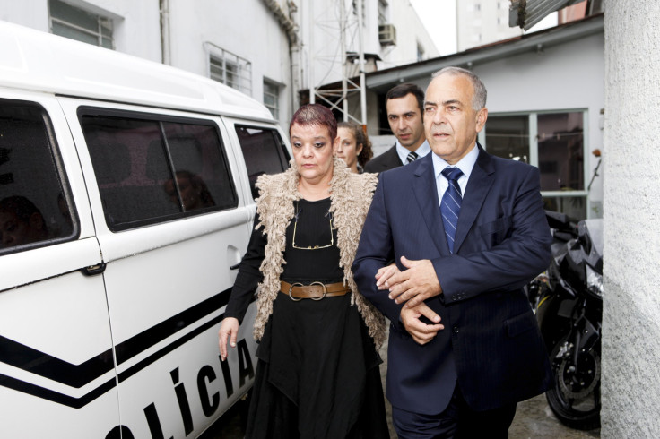 Doctor Virginia Soares de Souza (L) walks with her lawyer as they leave the police station in Curitiba 