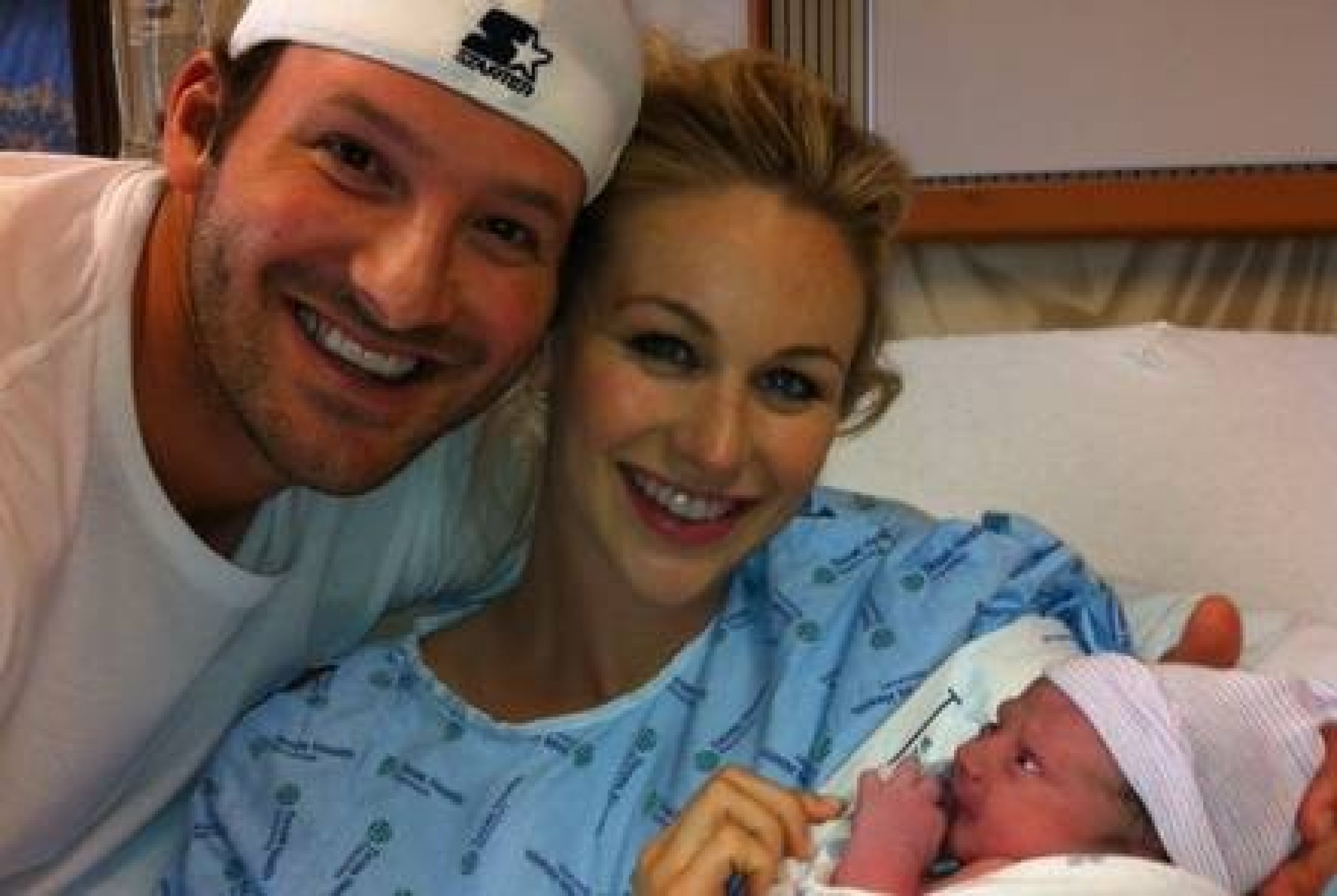 Candice, Tony and their new baby Hawkins Romo in their hospital room.