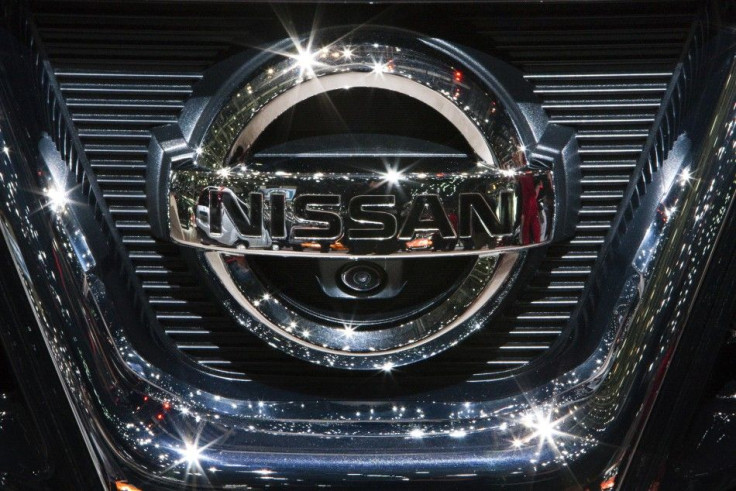 The Nissan logo on a car.