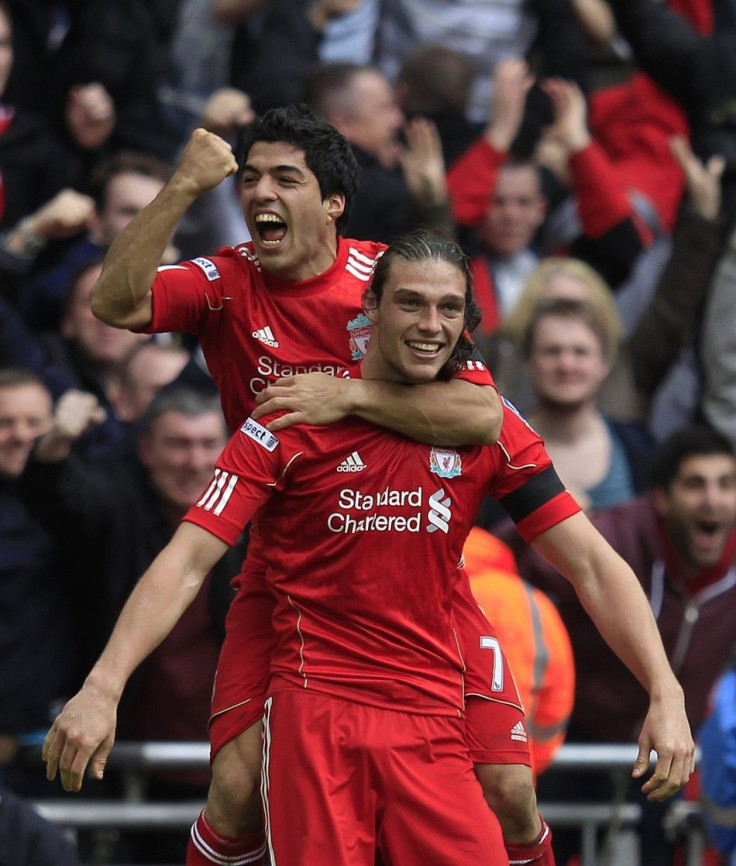 Liverpool&#039;s Luiz Suarez and Andy Carroll celebrate after downing Everton 2-1.