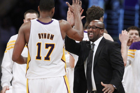 Mike Brown high-fives Andrew Bynum as he comes off the court. Their relationship has been rocky so far this season.