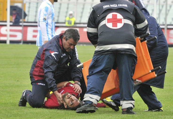 Piermario Morosini is attended to by emergency workers just moments after collapsing.