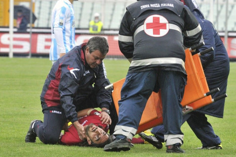 Emergency workers attempt to help Piermario Morosini after he collapsed during a Serie B game.
