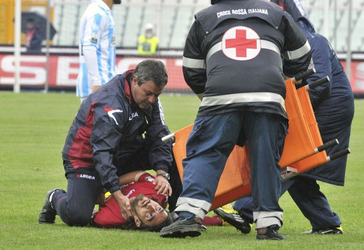 Emergency workers attempt to help Piermario Morosini after he collapsed during a Serie B game.