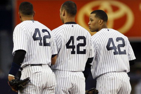 Alex Rodriguez, Derek Jeter and Robinson Cano wear Jackie Robinson's number before a game.