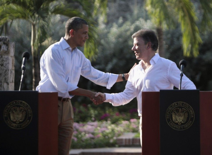 U.S. President Barack Obama and his Colombian counterpart Juan Manuel Santos shake hands at a joint news conference in Cartagena