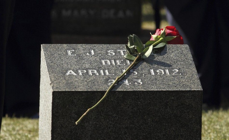 A flower rests on a grave marker of a Titanic victim during the 100th anniversary memorial service at he Fairview Lawn Cemetery