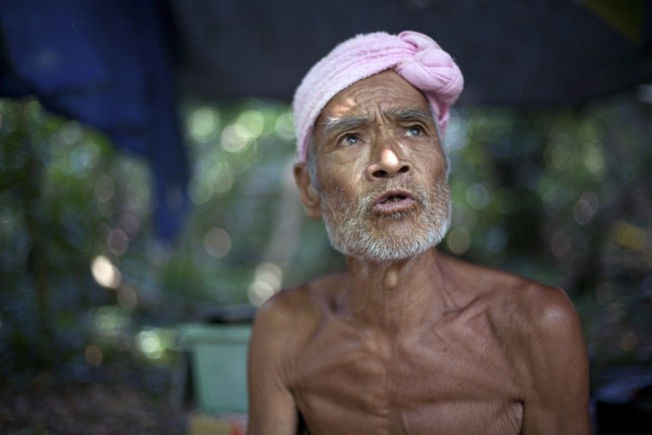 Seventy-six-year-old naked hermit Nagasaki speaks on Sotobanari island, Okinawa prefecture, Japan