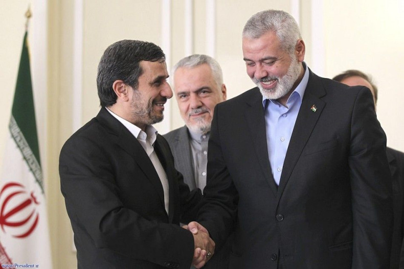 Iranian President Mahmoud Ahmadinejad welcomes Hamas leader Ismail Haniyeh at an official meeting in Tehran