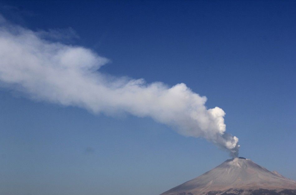 A plume of steam and ash is seen rising from the Popocatepetl volcano in San Nicolas de los Ranchos