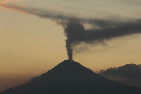 The Popocatepetl volcano spews a cloud of ash and steam high into the air as seen from Puebla