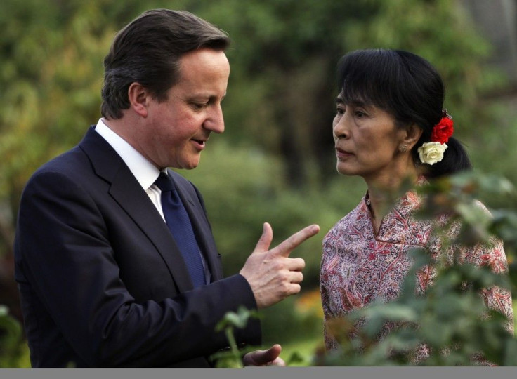 Britain&#039;s PM Cameron talks with Nobel laureate and Myanmar opposition leader Aung San Suu Kyi at her residence in Yangon