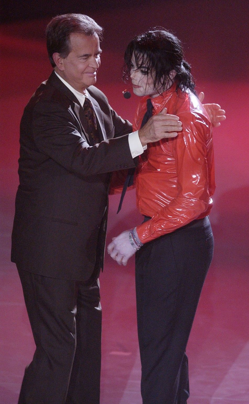 Singer Michael Jackson R is thanked by Dick Clark, host of quotAmerican Bandstands 50th...A Celebrationquot after performing quotDangerousquot for the show in Pasadena, California, April 20, 2002.