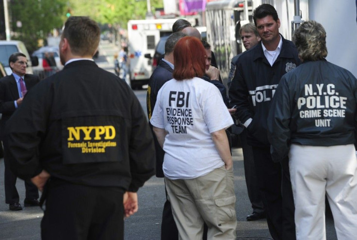 FBI and NYC police stand near apartment where they were searching basement for clues in 1979 disappearance of Etan Patz