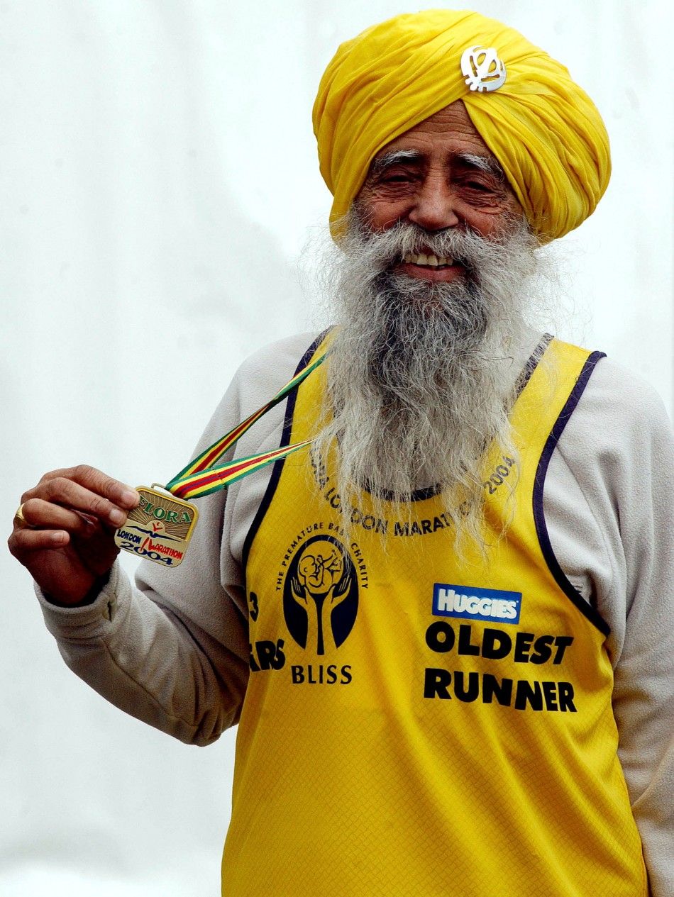 The oldest runner in the London Marathon 93-year-old Fauja Singh poses for photographers after finishing, April 18, 2004.