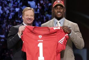 Defensive end Aldon Smith of University of Missouri with NFL Commissioner Goodell after being selected seventh overall pick by 49ers in 2011 NFL football Draft in New York