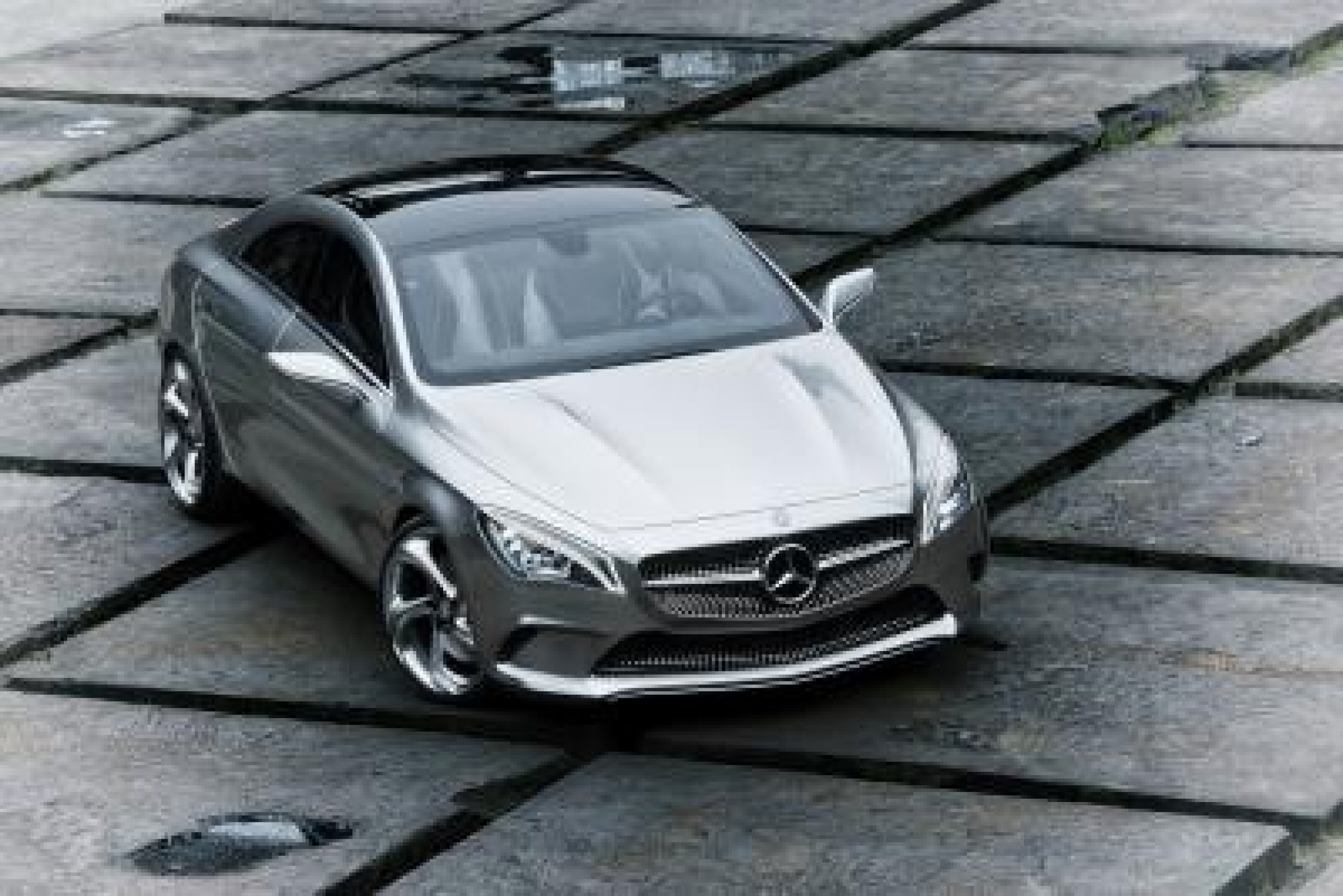 The Mercedes Concept Style Coupe parked on some enormous tiles.