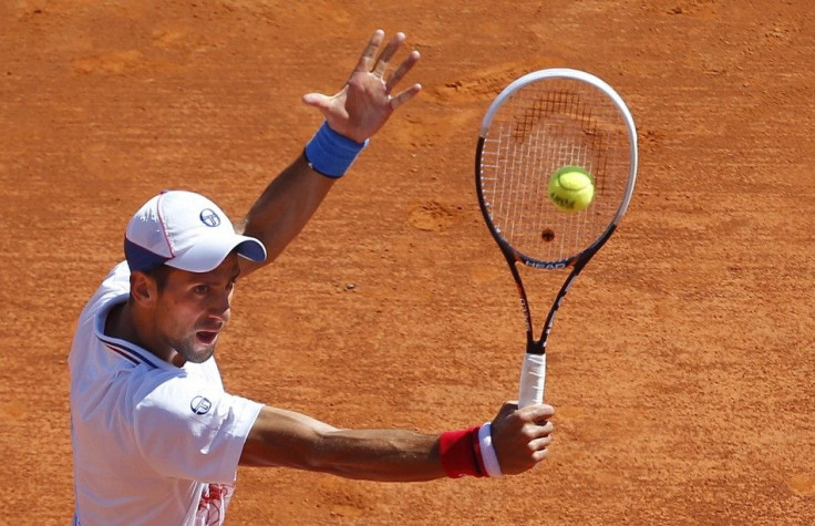 Djokovic returns the ball to Haase during the quarter-final of the Monte Carlo Masters in Monaco