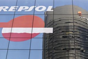The Sacyr Vallehermoso Tower is reflected on the Repsol office building in Madrid