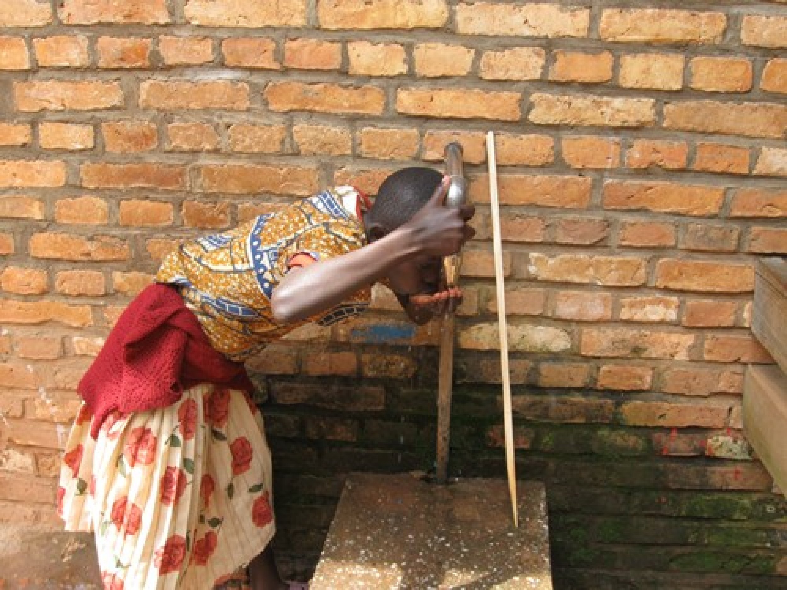 Girl Drinking Water in Rwanda.