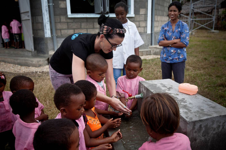 Katy Perry washes her hands with kids in Madagascar