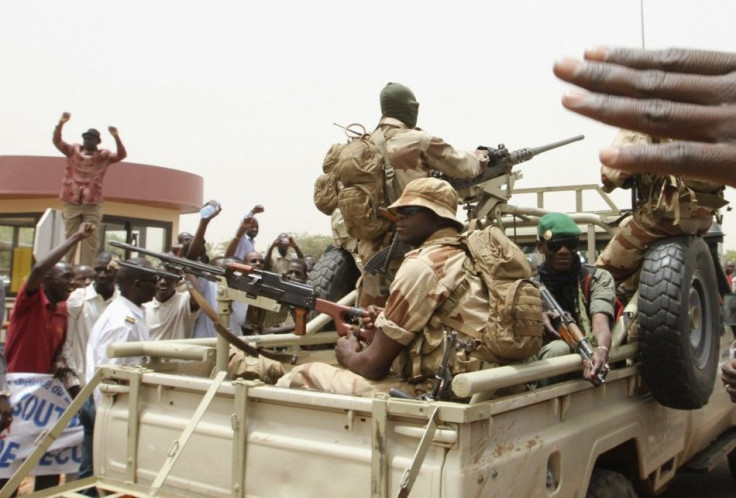 Supporters of Mali&#039;s junta participate in a demonstration against regional bloc ECOWAS at the international airport of Bamako