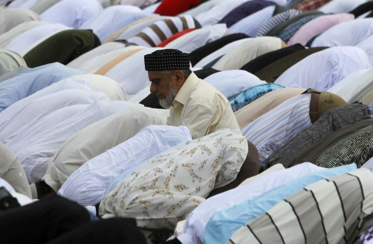 A man prays during Eid al-Fitr prayers on the waterfront in Colombo