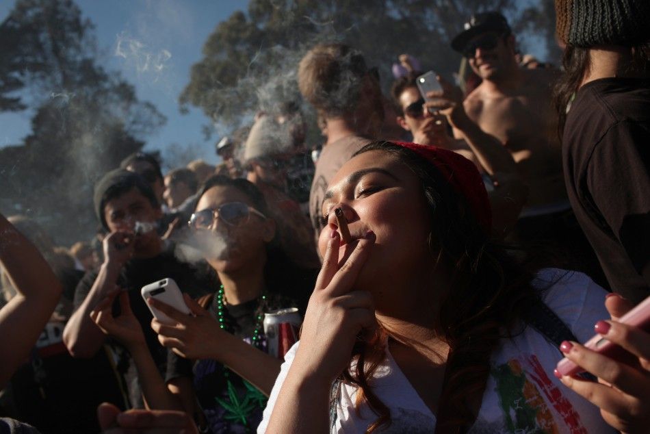 People smoke marijuana joints at 420 p.m. as thousands of marijuana advocates gathered at Golden Gate Park in San Francisco