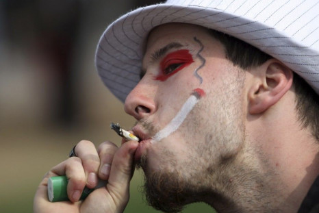 A man smokes marijuana during a 4/20 rally to demand the legalization of marijuana on Parliament Hill in Ottawa