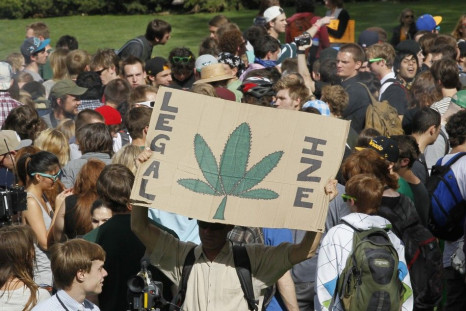 Students and others smoke marijuana at a pro-marijuana rally at the University of Colorado in Boulder