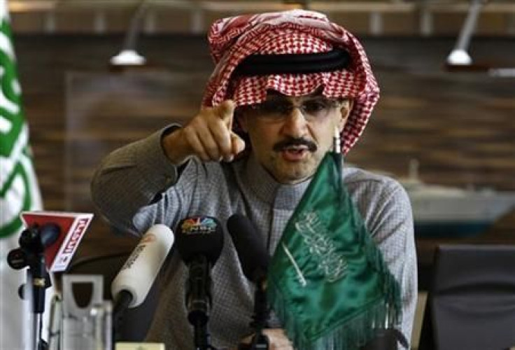 Saudi billionaire Prince Alwaleed bin Talal reacts during a news conference in Riyadh