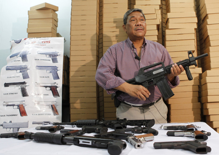 Filipino businessman Romulo de Leon, owner of Shooters Arms, a gun manufacturing company exporting different kinds of weapons to other countries, shows the weapons produced by former illegal gunsmiths in his factory in Cebu city in central Philippines