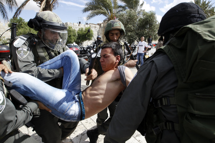 Palestinian man and Israeli soldiers