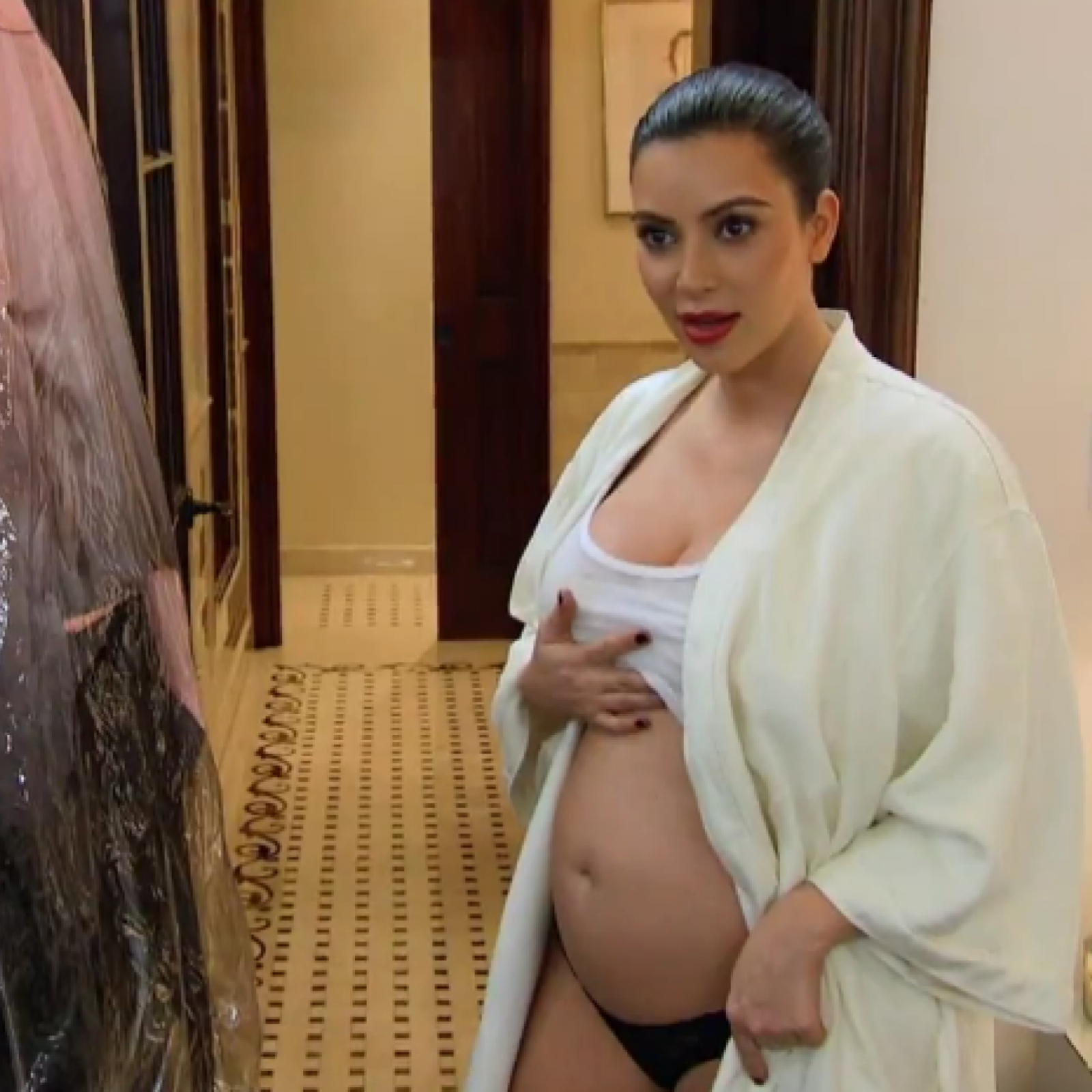 kim kardashian brown dress pregnant Where is Kim's bump? Fans question Kim Kardashian's pregnancy as stomach looks very flat at MTV VMAs