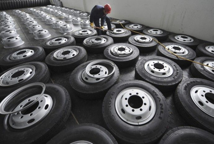 An employee installs tire rims at a factory of Zhengxing Wheel Group in Hefei. 