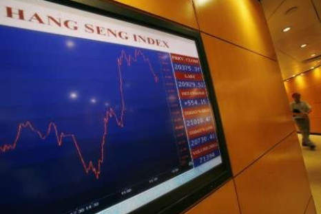 A panel displays the daily blue-chip Hang Seng Index movement at the Hong Kong Exchange 