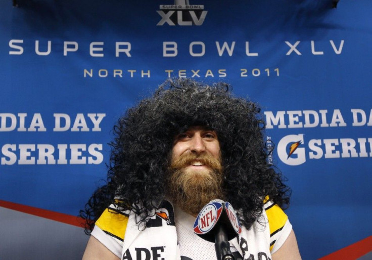 Pittsburgh Steelers defensive end Brett Keisel wears a Troy Polamalu wig during media day for Super Bowl XLV at Cowboys Stadium in Arlington.