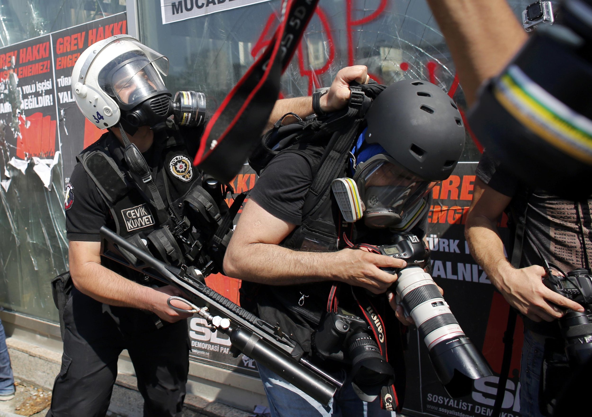 Riot Police Push Photographer