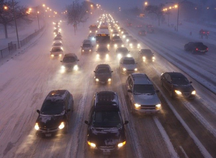 Rush hour traffic crawls as blowing snow batters Lake Shore Drive in Chicago February 1, 2011.