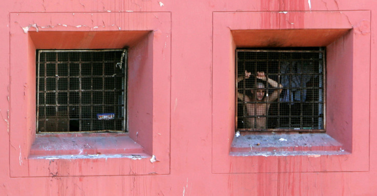 A prisoner appears in the window of Regina Coeli jail in Rome/