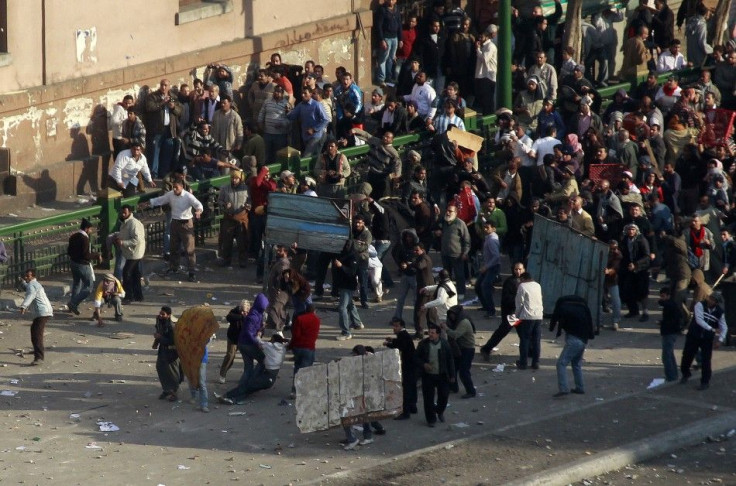 Pro-government protesters clash with anti-government protesters in Tahrir square