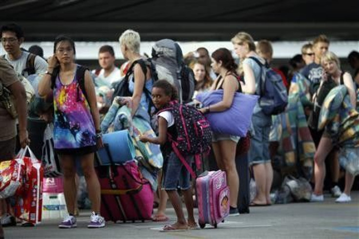 A girl waits in line to enter an emergency cyclone shelter in a shopping mall in the northern Australian city of Cairns