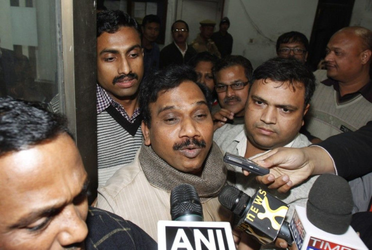 India's former telecommunications minister Raja speaks to the media as he leaves the CBI office in New Delhi