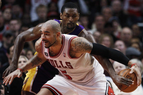 Chicago Bulls Carlos Boozer and Los Angeles Lakers Ron Artest battle for control of the ball in Chicago.