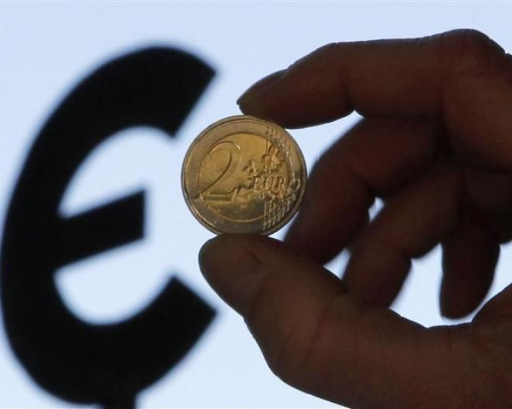 Euro coin and euro logo 