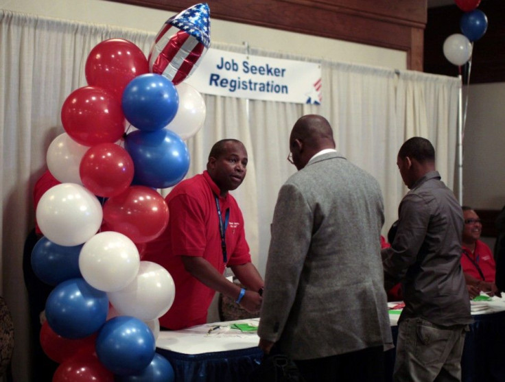 People arrive at a veterans job fair in Los Angeles